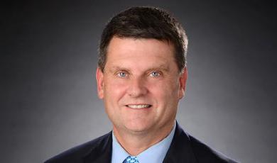 Headshot of Jim Dunphy with a black and white background